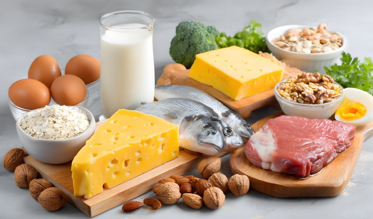 Selection of protein rich foods including eggs, milk, fish and cheese